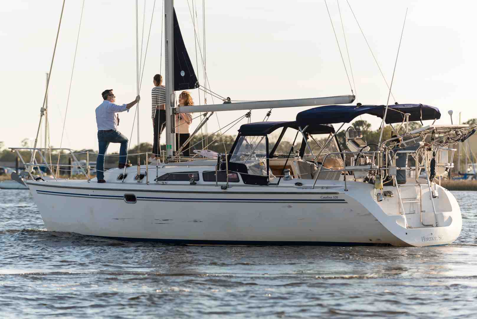sleek monohull sailboat and a spacious catamaran - cost of private cruise