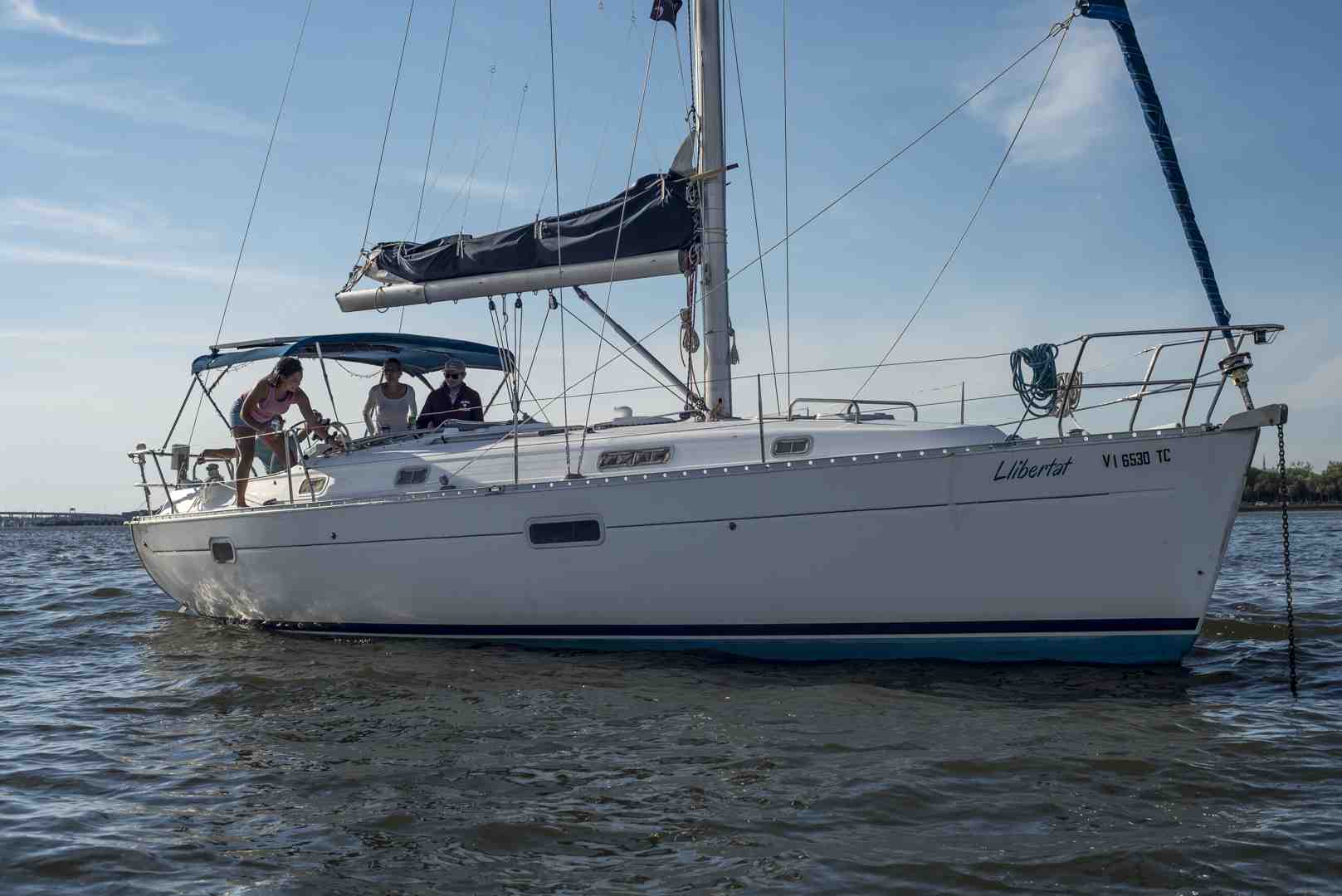 sleek sailing catamaran gliding through the harbor - charter boat cruises