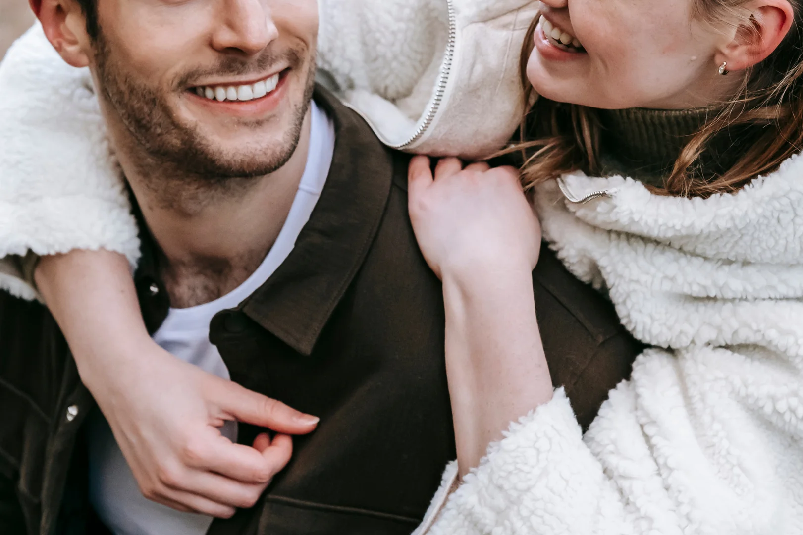 Soft-focus photograph of a couple where the female partner hold male partner's shoulder lovingly - strengthen your marriage Soft-focus photograph of a couple where the female partner hold male partner's shoulder lovingly - strengthen your marriage