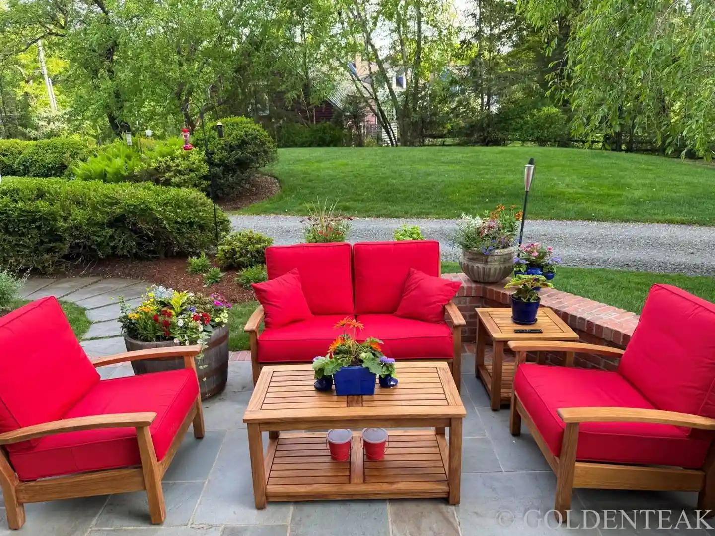 Person relaxing on comfortable outdoor loveseat with a book - Buy outdoor loveseat