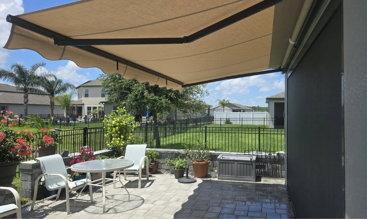 high-quality retractable awning installation on a Florida coastal home