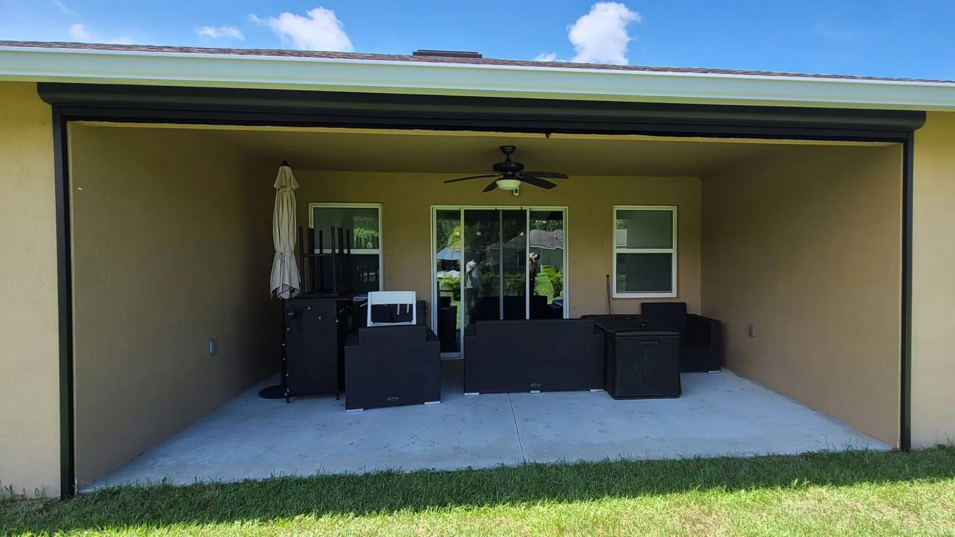 motorized patio screens for vertical backyard shade ideas on a Space Coast home