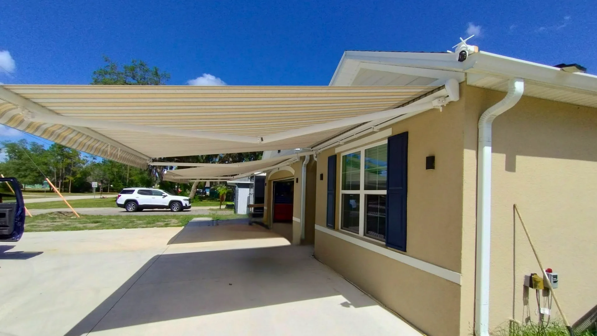 Retractable awning extended over a residential patio