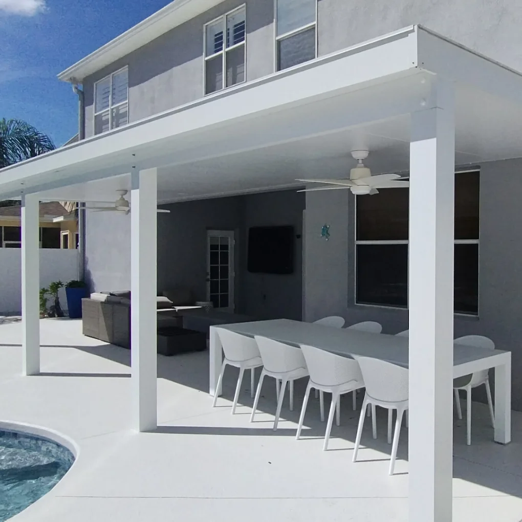 completed modern aluminum pergola providing shade over an outdoor kitchen