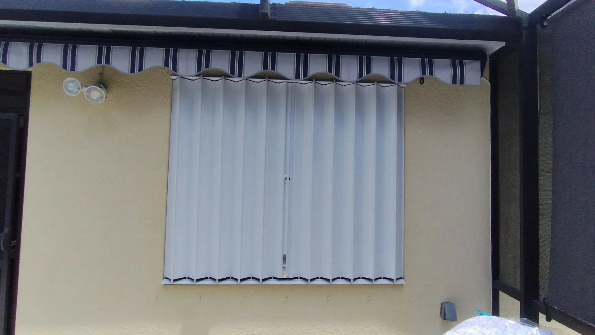 Hurricane shutter protection installed across a large exterior opening Hurricane shutter protection installed across a large exterior opening