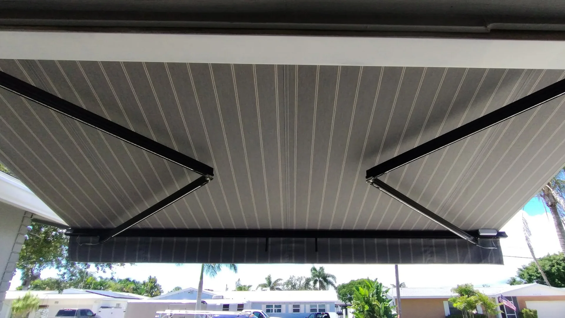 Retractable awning installed over a residential patio Retractable awning installed over a residential patio
