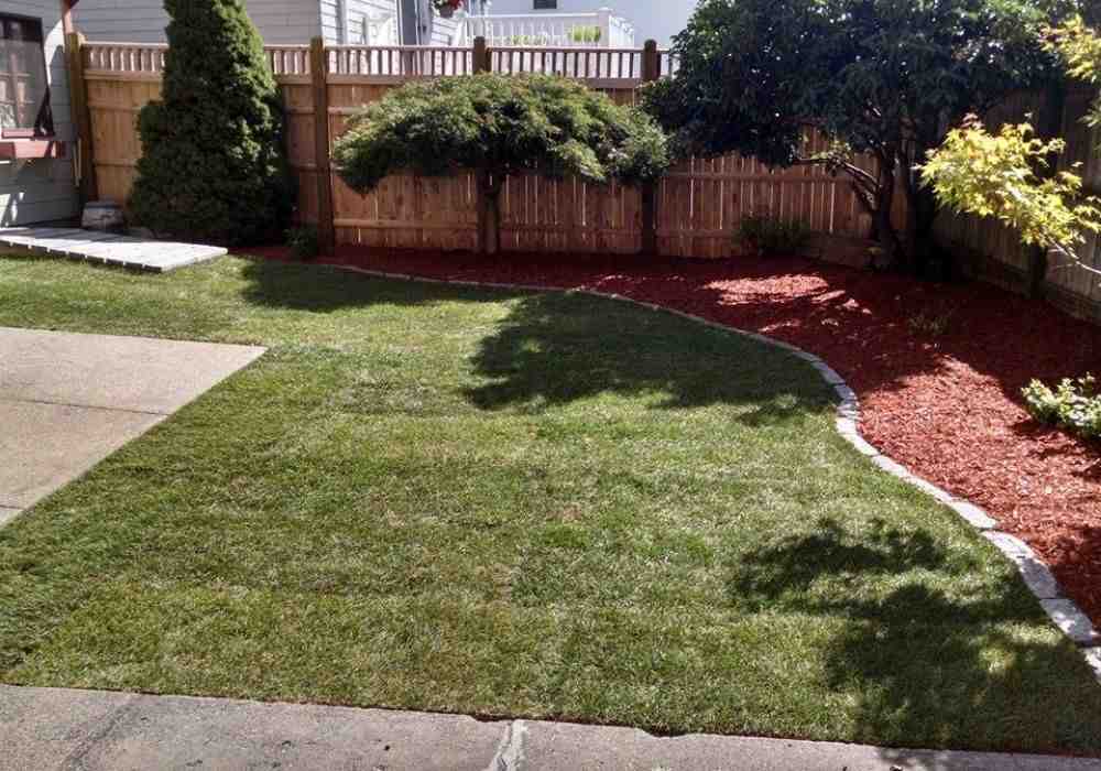 Beautiful landscaped garden with bark mulch - bark landscaping