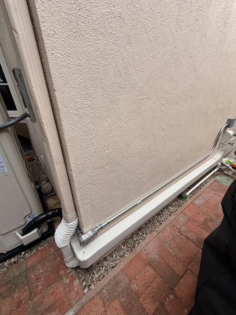 technician inspecting outdoor AC condenser - ac installation company in national city, ca