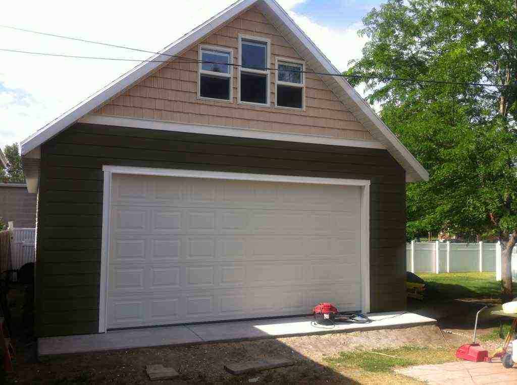 detached garage with attractive landscaping - how much to build a detached garage