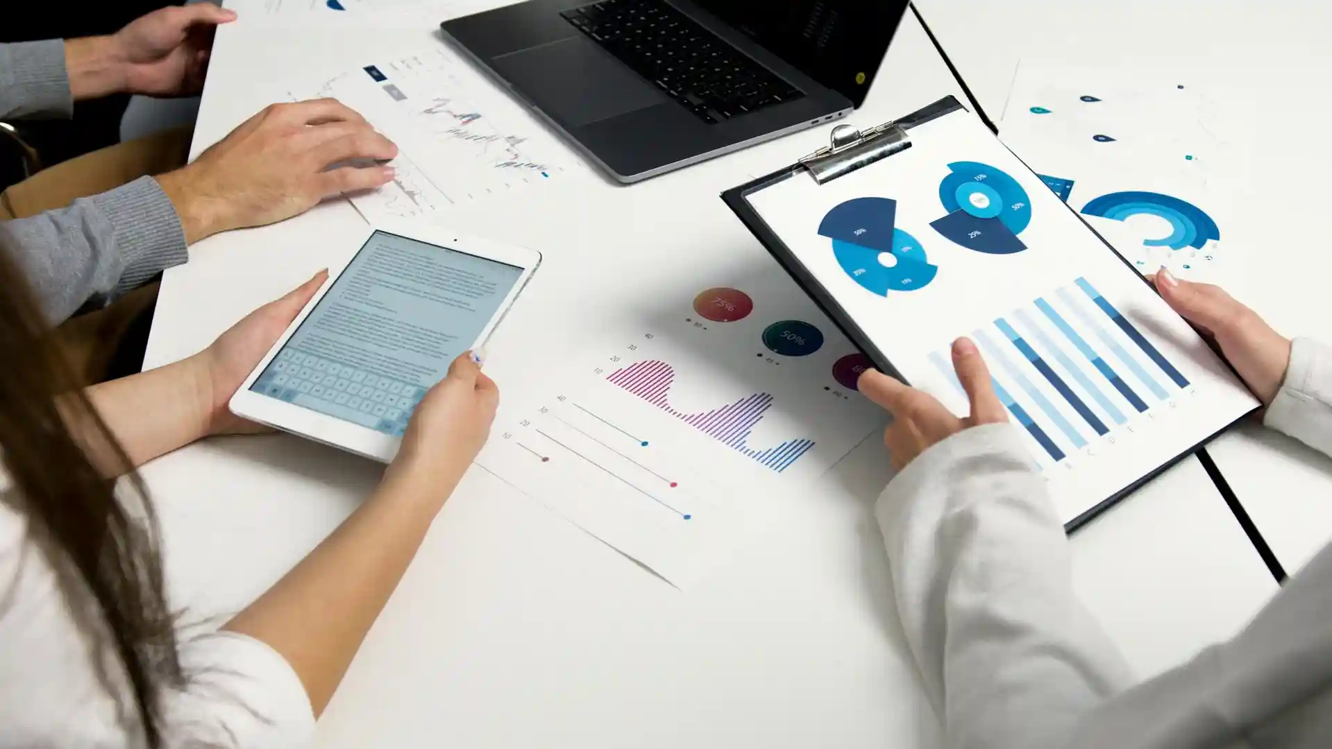 Team setting marketing goals in a modern office with digital tools and charts visible - content distribution marketing