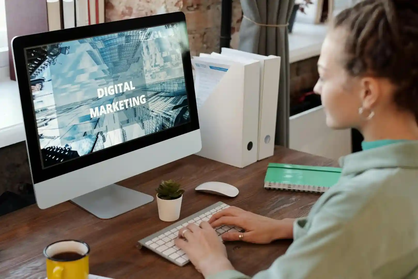 Marketing professional typing on keyboard - auto backlink builder