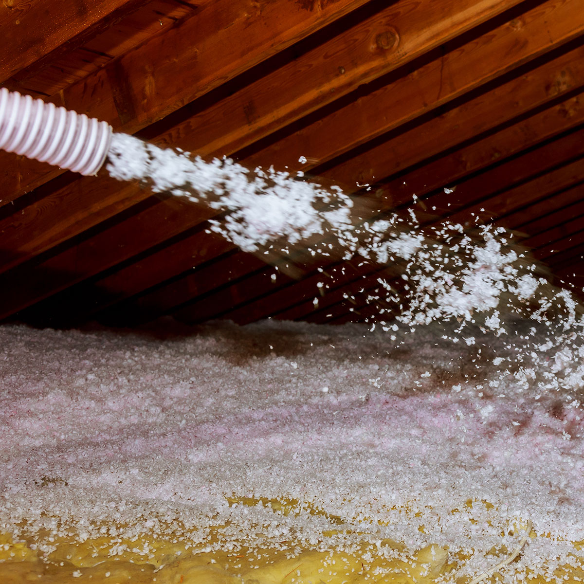 blowing insulation into an attic