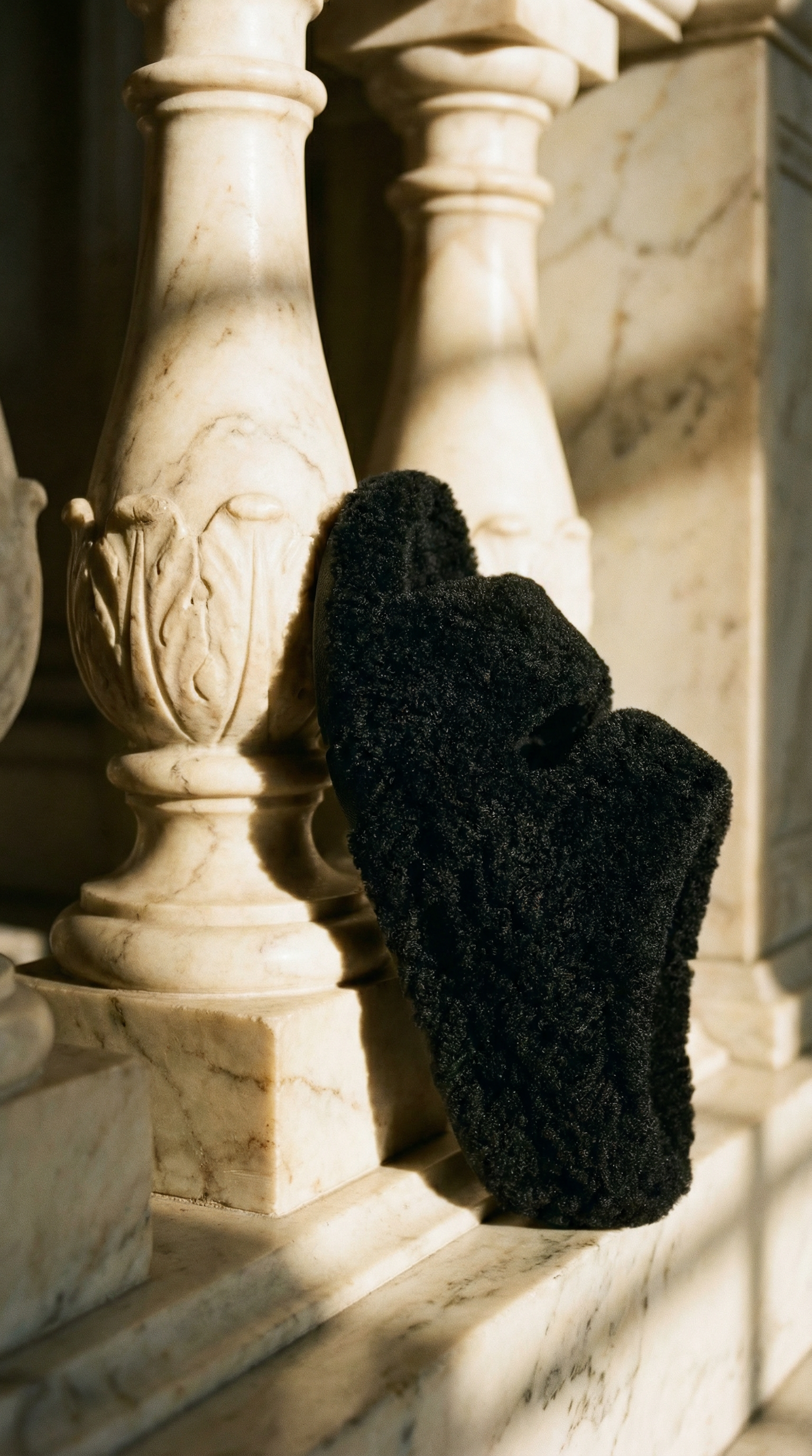 AI product shot of SHUV Curly-Shearling Slides