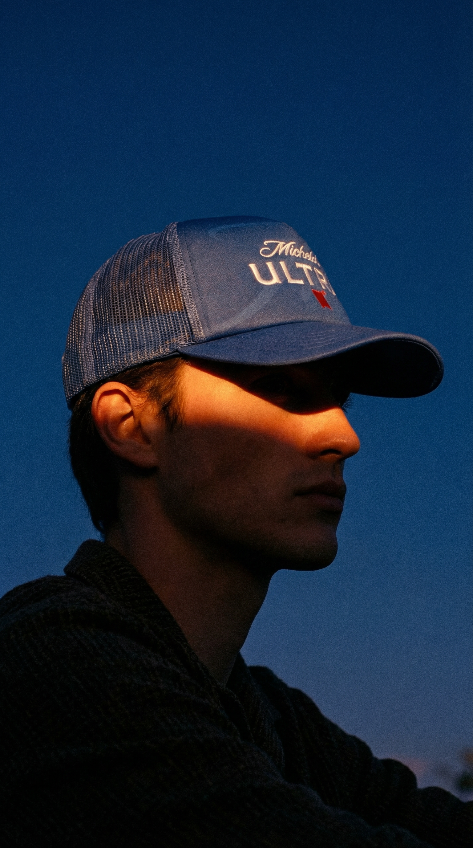 AI product shot of Michelob Ultra Blue Trucker Hat