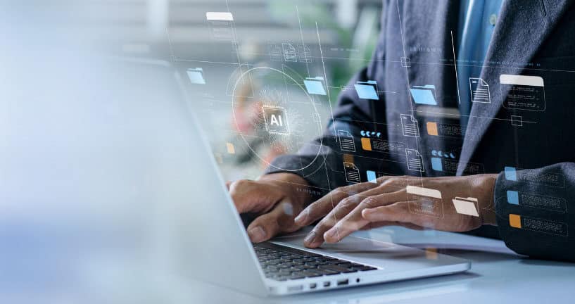 Persona trabajando con inteligencia artificial en una computadora port&aacute;til