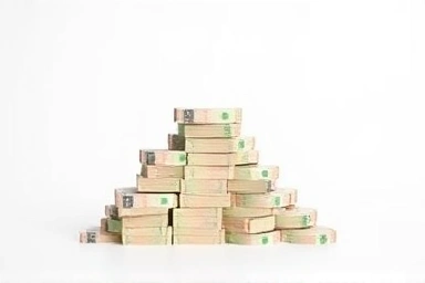 Abstract representation of growing Korean Won stack reaching a peak.