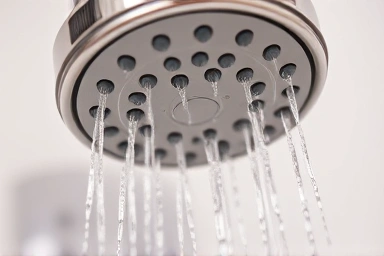 Showerhead with filter, symbolizing clean and healthy water.