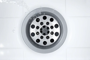 Clean, flowing bathroom drain with no clogs.
