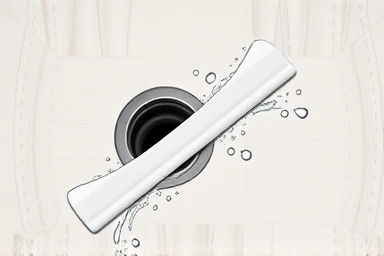 Close-up of silicone squeegee blade perfectly clearing water from tile.