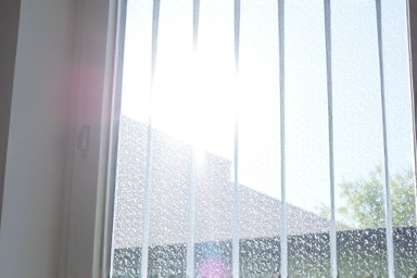 Sunbeam through a crystal clear window, before and after contrast.