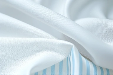 Close-up of cool fabric textures for summer bedding.