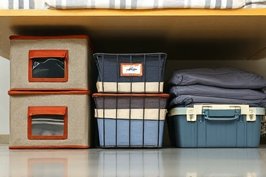 Variety of under-bed storage containers, functional and organized.