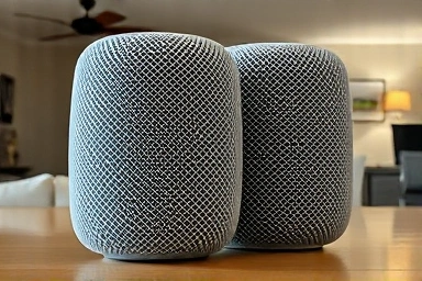 Close-up of Apple HomePod 2nd gen stereo speaker design.