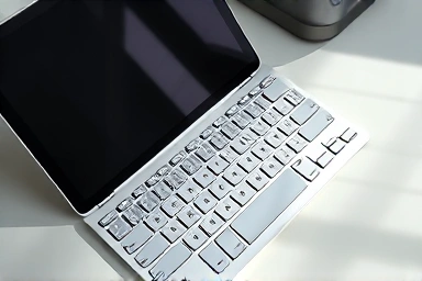 iPad Pro with Magic Keyboard on a modern desk.