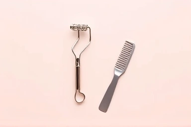 Elegant eyelash curler and comb set.