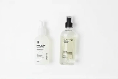 Two hair essence bottles showcasing different formulas and benefits.
