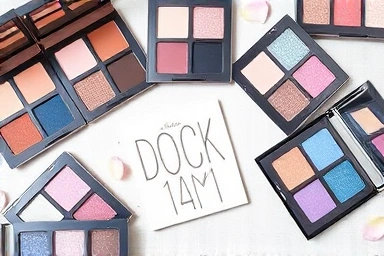 Eyeshadow palettes with cool-toned pink, blue, and lavender shades