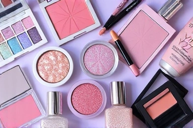 Y2K makeup flat lay with iridescent highlighters