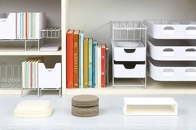 Close-up of practical bookshelf organization tools and accessories.
