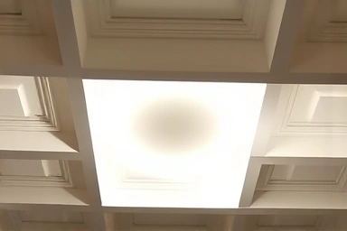 Close-up of hidden indirect LED lighting in a coffered ceiling