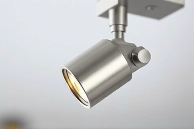 Close-up of adjustable track lighting joint mechanism.
