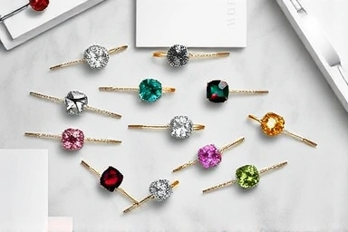 Artful flat lay of Pandora birthstone and stacking rings.
