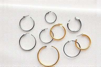 Variety of hoop earring sizes and styles laid out