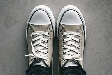 Minimalist sneaker with hidden laces, clean style