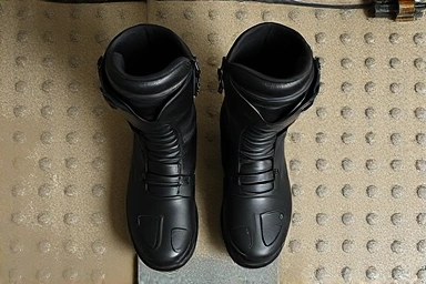 Close-up of racing and touring motorcycle boots