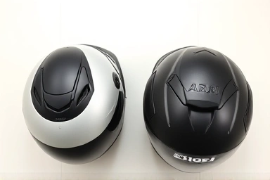 SHOEI and ARAI motorcycle helmets side-by-side for size comparison.