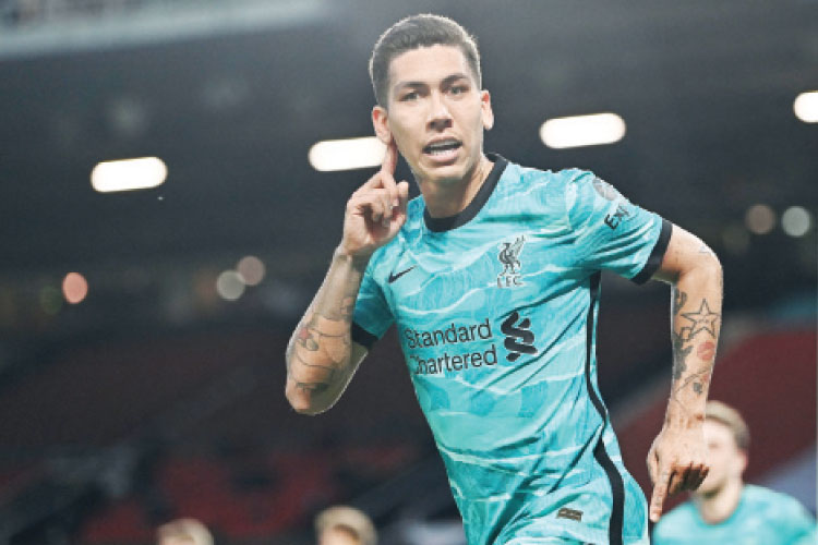 مهاجم ليفربول روبرتو فيرمينو - (أ ف ب)