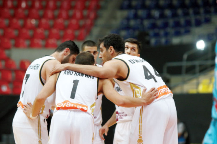 لاعبو المنتخب الوطني لكرة السلة في مباراة سابقة أمام كازاخستان - (الغد)