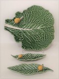 Leaves with snails. Large cheese platter shaped like a cabbage leaf with a snail. Small plate in the shape of a loquat leaf with a snail. Hand painted and finished., , 2019
