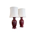 Pair of chinese vases adapted into lamps. Oxblood porcelain, fabric and woodbases. Lamp shade with adjustable height., 84 cm,