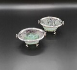 Pair of fluorite crystal bowls with silver mountings. Upper silver ring with Eagle&#39;s Head hallmark for 925/1000 and for the jeweller&#39;s A. Gomes and lower section with Eagle&#39;s Head hallmark for 835/1000, both from Porto. Restoration to the crystal., 5,5x11,5x8,5cm, 20th century - séc. XX