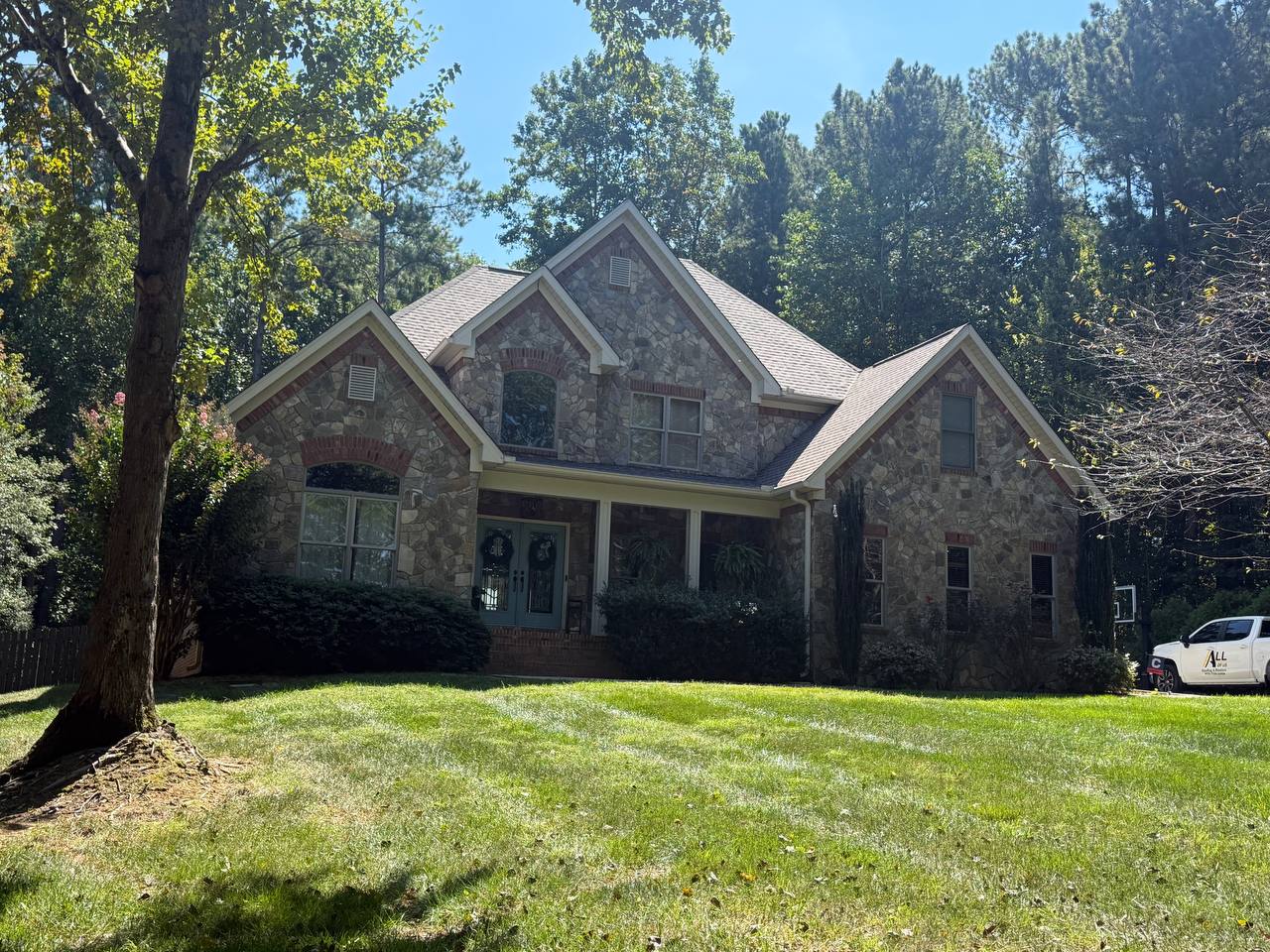 Completed residential roof by All Of Us Roofing & Restore