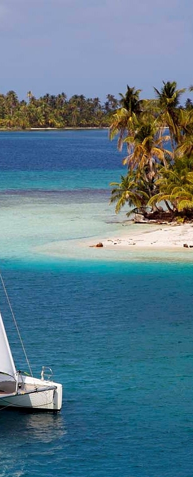 Catamaran passing Island