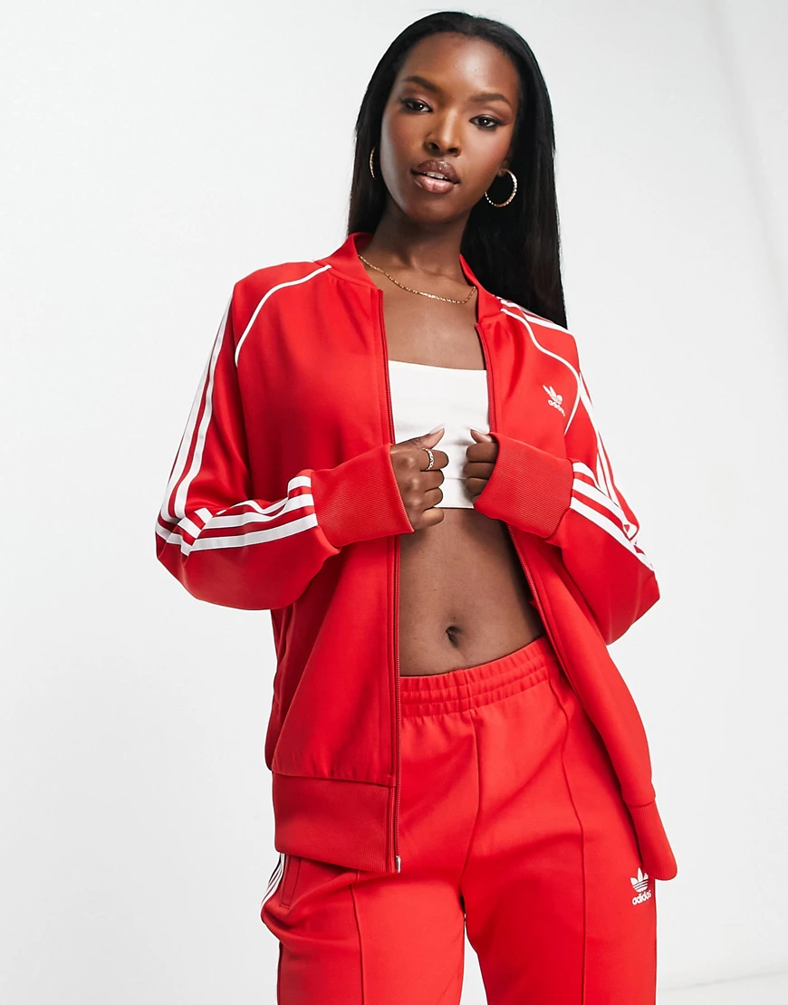 adidas Originals adicolor track jacket in red