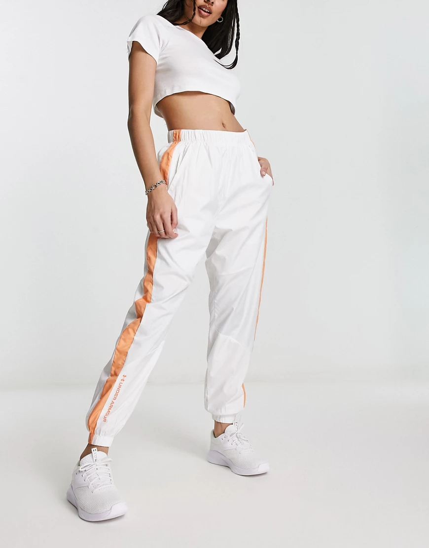 Under Armour Rush Woven Pant in white and orange