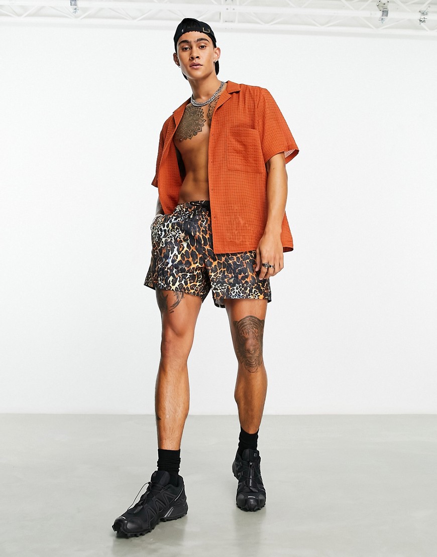 ASOS DESIGN swim shorts in short length in leopard print-Multi